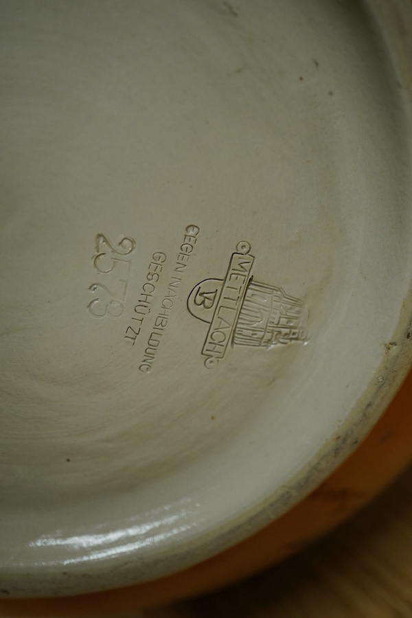 A Mettlach stoneware floral vase, impressed marks, 36cm high. Condition - fair/good